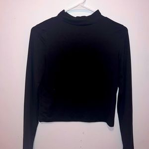 pair of black and white turtleneck cropped long sleeves